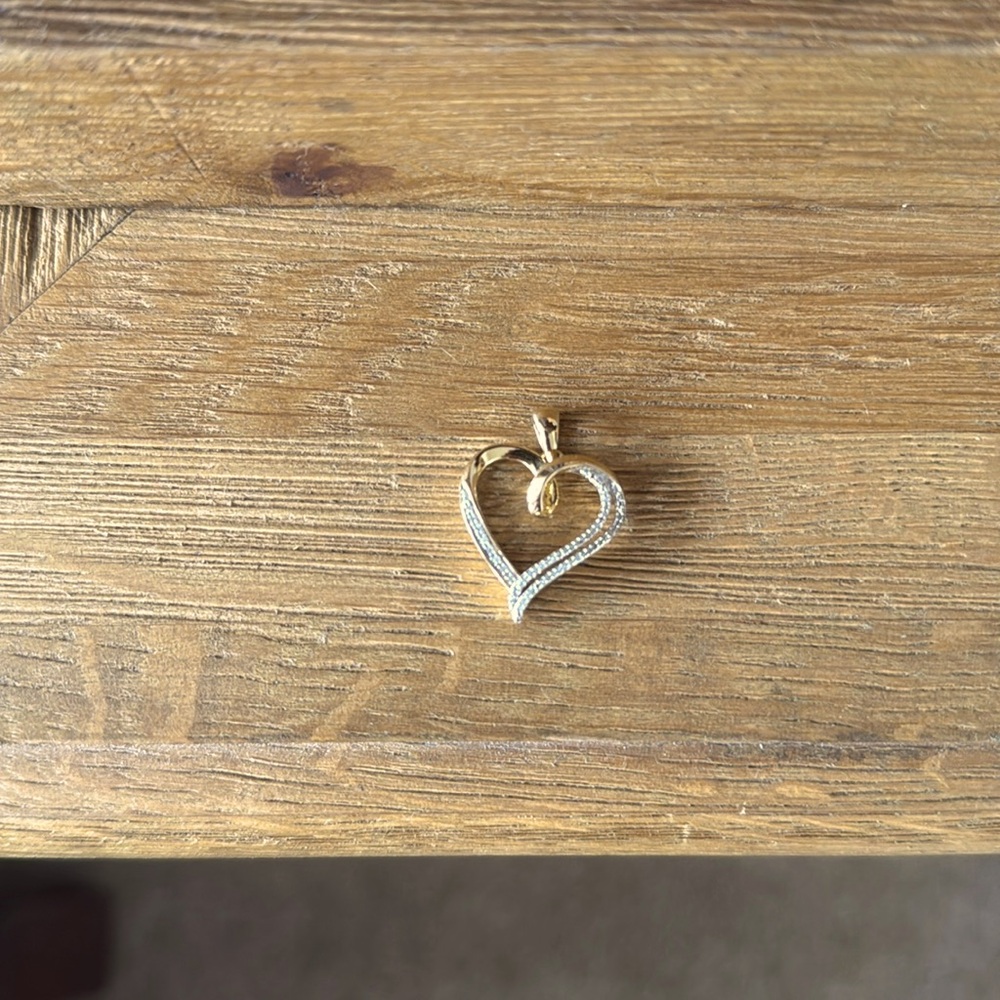 Beautiful heart pendant with small diamonds made of gold plated sterling silver.